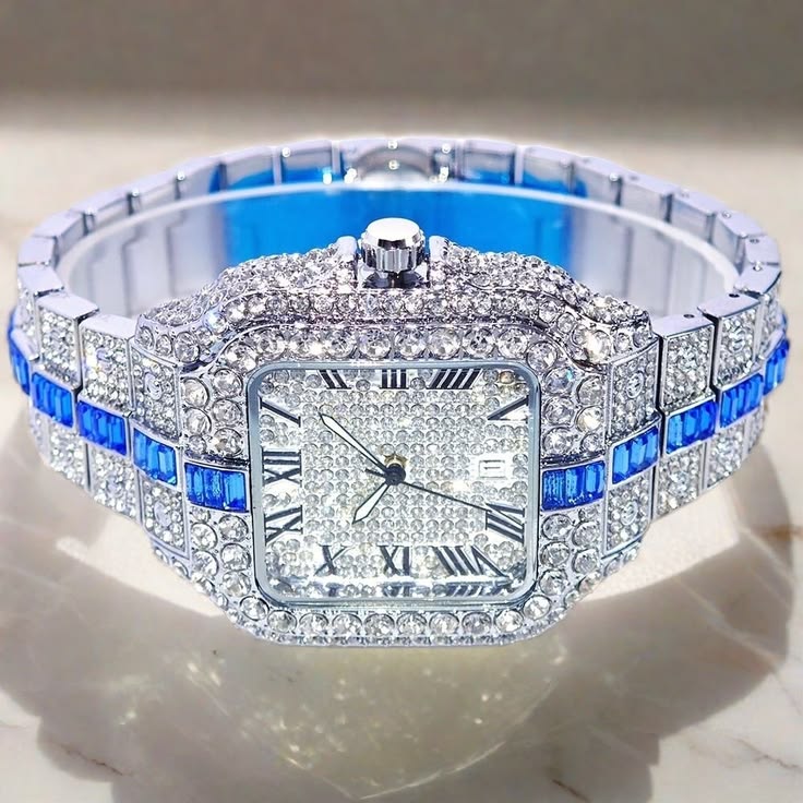 Silver watch with blue sapphire accents