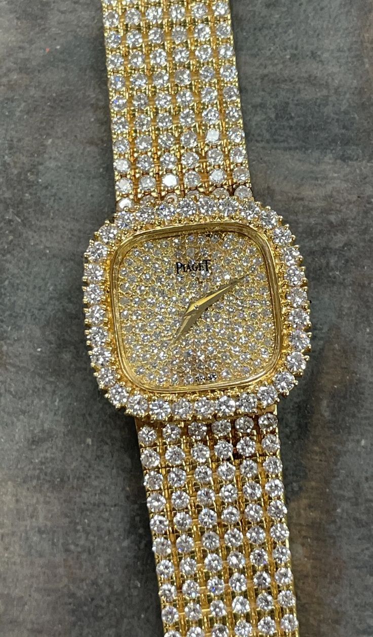 Gold diamond watch on a woven bracelet
